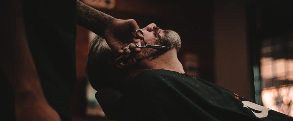 Barber cuts beard