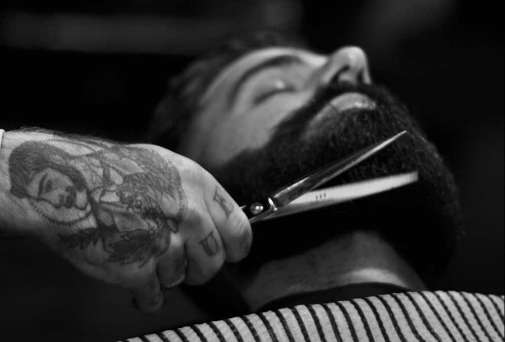 Barber cuts beard