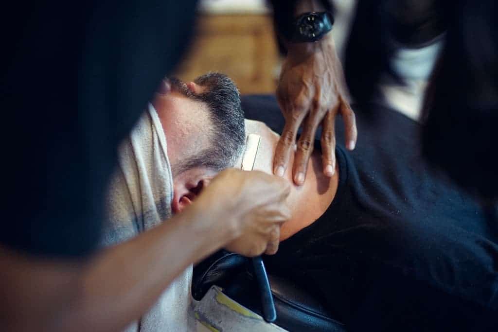Barber shaves neck line