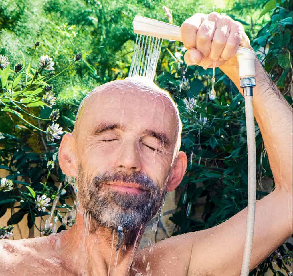 Man with beard showers